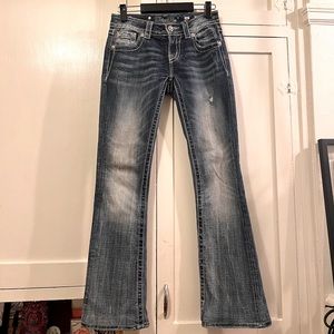 Size 26. Miss Me Signature Bootcut Jeans. Dark Blue w/ Distressed Wash.